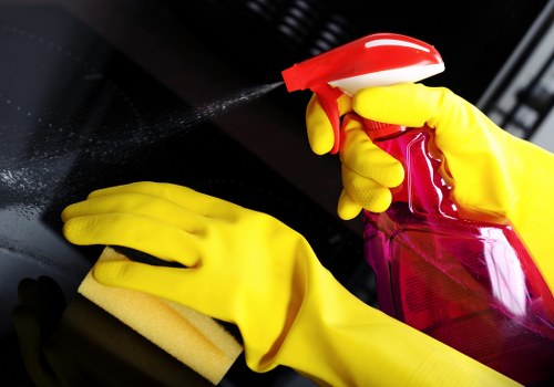 Local curtain cleaning specialist handling hanging curtains in Fulham